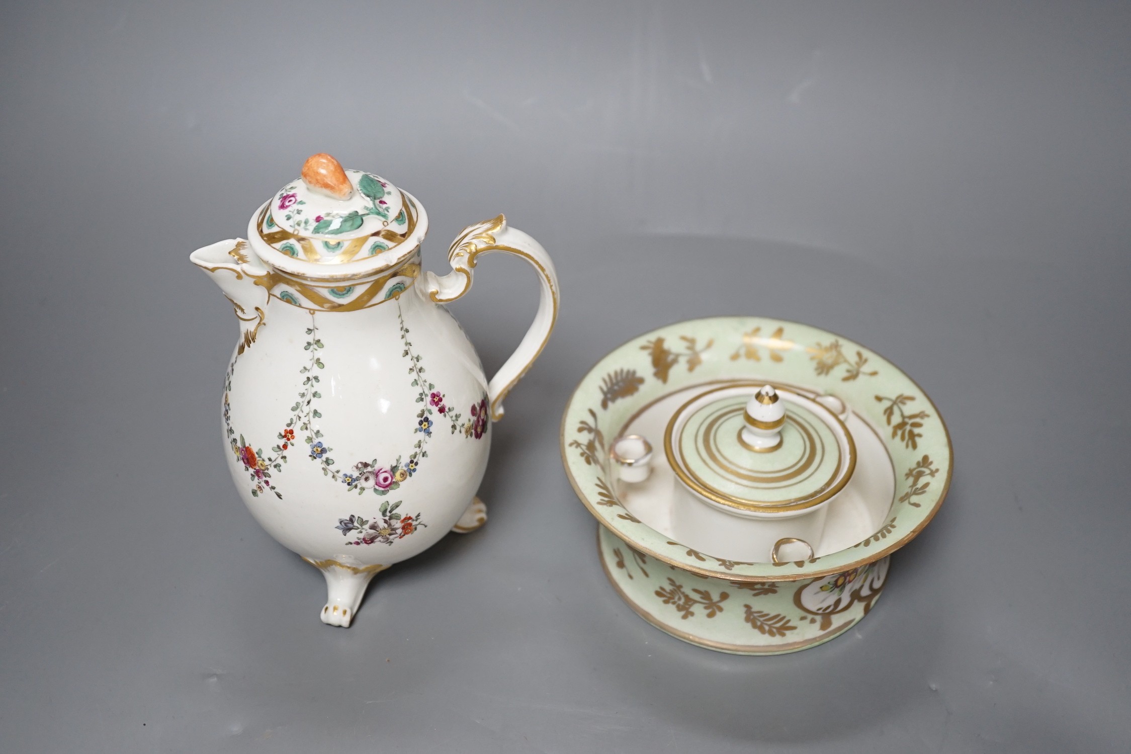 A Ludwigsburg three footed jug and cover painted with swags of flower c. 1770 and a 19th century French porcelain inkwell and cover a colourful gilt floral panel, jug and cover 17 cms high